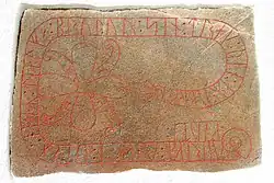 The runestone Ög 111 with a cross in Ringerike style