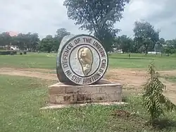 A sculpture with the words "In defence of the unborn child. Stop abortion." and a stylised fetus.