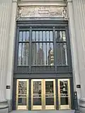 London Guarantee Building entrance commemorates Fort Dearborn in a brass and bronze relief panel above the lintel.