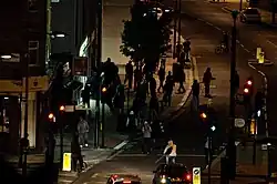 Looters attempting to enter a cycle shop in North London during the 2011 England riots