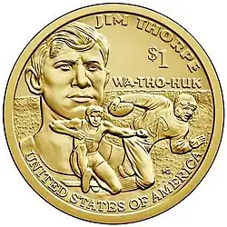 One dollar coin depicting a headshot and two body shots of Thorpe competing. The text reads "Jim Thorpe / Wa-Tho-Huk" on top and "United States of America" on the bottom.
