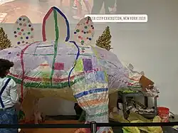 Light lavender stegosaurus with polka dots and stripes