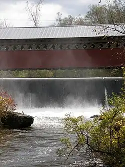 Side view of Paper Mill Covered Bridge over Wallomsac River dam