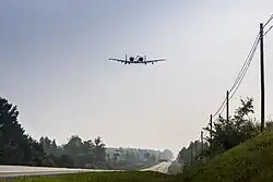 An A-10 Thunderbolt II from Selfridge Air National Guard Base, Michigan, prepares to land on a public highway in Alpena, Michigan, 5 August 2021
