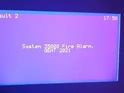 A Gent System 32000 32025 Repeater Panel connected to a Vigilon