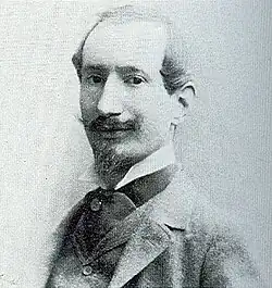 Beltrame in a black and white headshot