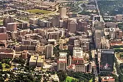 Aerial view of the Texas Medical Center's main campus looking south from Hermann Park. Brays Bayou is visible at the top of the image.