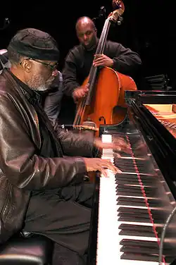 James Cammack plays double bass with pianist Ahmad Jamal in the foreground.