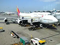 Two Aircraft Catering Vehicles serving an aircraft