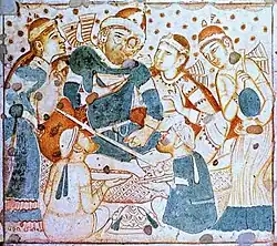 Possible Bactrians revelling, on the ceiling of the central hall of Cave 1 of Ajanta caves, India (460–480 CE).[14][15][16]