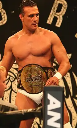 Alberto El Patrón with the fourth title belt design, after the company was renamed "Global Force Wrestling".