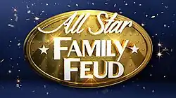 A gold oval badge on a starry background, the badge reads "All Star Family Feud