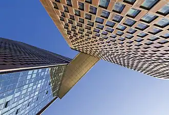 View from below the skybridge of the American Copper Buildings on a sunny day in 2018