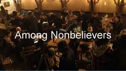 Titlecard showing the text Among Nonbelievers, with a gathering of Turkish atheists in the background.