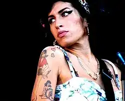 Image 96In 2008, Amy Winehouse tied the then record for the most wins by a female artist in a single night and became the first British woman to win five Grammys. (from 2000s in music)
