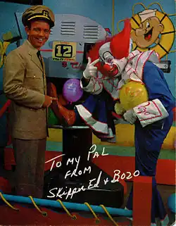 A publicity photo of Skipper Ed, a man in a captain's outfit, and Bozo the Clown, a clown, with a WFGA-TV camera. The photo is signed: "To My Pal from Skipper Ed and Bozo".