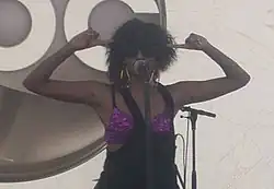 A woman singing into a microphone