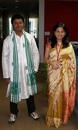 Image 126Indian couple wearing a mixture of traditional dress and Western clothing (from 2000s in fashion)