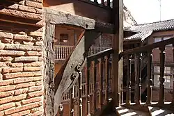 Astorg: molded balusters, opposed volutes.