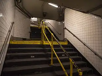 Stairs leading up to street level and the IND station