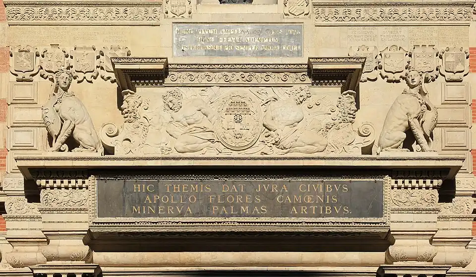 The middle part of the portal (1561) depicts enslaved prisoners