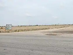 Road branching off the Indus Highway towards the town.