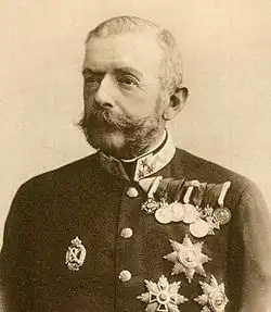 A bearded man in a military uniform