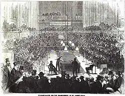A crowd watching a billiards match