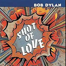 A pop art-style drawing of an explosion with the words "SHOT / OF / LOVE" written in the middle