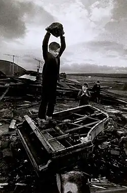 Image 25Boy destroying piano at Pant-y-Waen, South Wales, by Philip Jones Griffiths, 1961 (from Photojournalism)