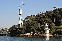 Bradleys Head Light on the right. Foremast of HMAS Sydney on left
