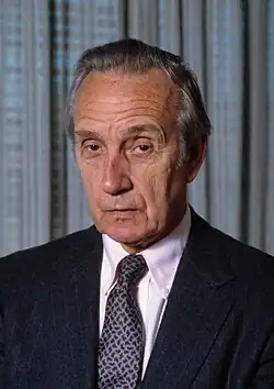 Urquhart posing in a suit