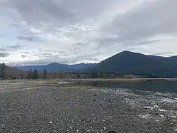 Brinnon as seen from the shore of the Hood Canal with the Olympic Mountains in the background