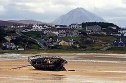 Bunbeg with Errigal in the background and Bád Eddie (Eddie's Boat) on Magheraclogher Strand