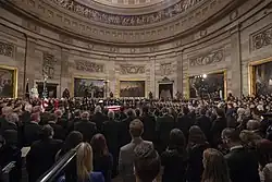 Mourners circumambulate the casket of George Bush during the lying in state on December 3, 2018