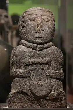 Figurine of bard with lute from Brittany
