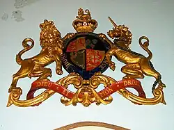 The Royal Coat of Arms given by King George V to replace an earlier set which were lost in a fire. These arms hang above the west door.