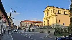 The main street of the comune with Ss. Alexander and Martin parish church (XIII c.) and the Curt dal Sacrista historical house (XVIII c.)