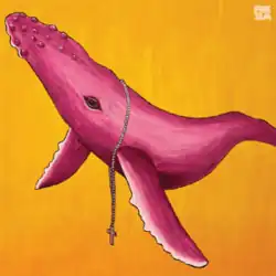 A pink humpback whale with a cross necklace hung around its neck against a yellow background