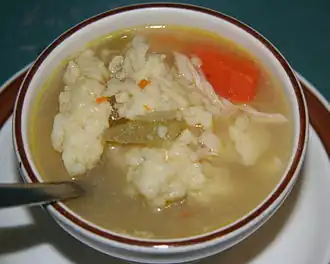 A bowl of chicken and dumplings