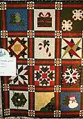 Book Club Friends 4ever quilted by Dixie Davies. Sampler patch style with Christmas prints.