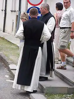 Cistercians in their religious habit (with the black scapular).