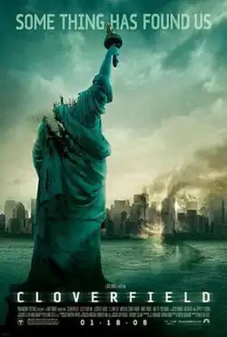 A decapitated Statue of Liberty is in front of a partially wrecked New York City.