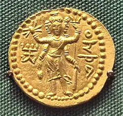 Three-faced Oesho, often identified with Shiva, on a coin of Huvishka[19]