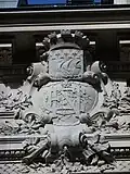 Cartouche on the rear façade displaying the bank's initials CNE under the coat of arms of Paris