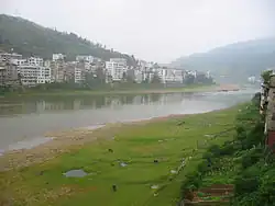 View of the county seat from along the Duliu River (17 August 2003)