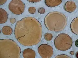 Cordwood masonry wall detail. This alternative building method is called cordwood masonry, cordwood construction or stackwall because the wall resembles a stack of cordwood. Source: Rob Roy, Earthwood Building School. http://www.cordwoodmasonry.com