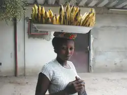 A woman carrying bananas in the Democratic Republic of the Congo