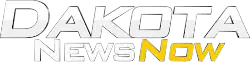 The word Dakota, italicized in Bank Gothic typeface large in white, with "News Now" beneath in white, unitalicized, and yellow, italicized.