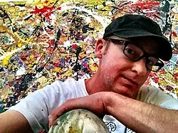 Davyd Whaley with his painting "Come Back to Me"